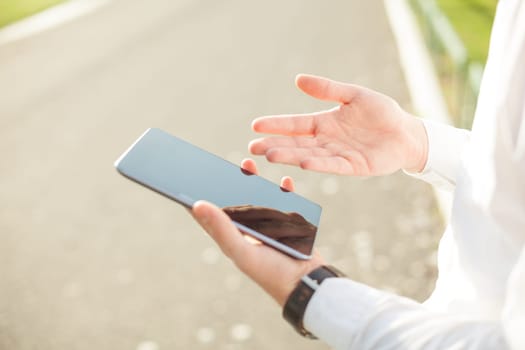 Close up of man hands using touchscreen on digital tablet