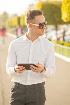 Traveling Man With Mobile Phone And Hat, In City, Urban Space