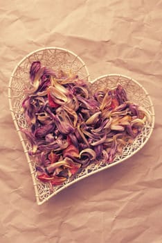 Heart shaped bowl with purple petals, romantic love concept background