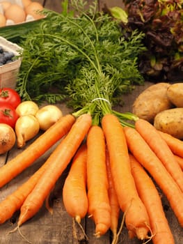 Healthy food concept with fresh vegetables on a rustic wooden kitchen table