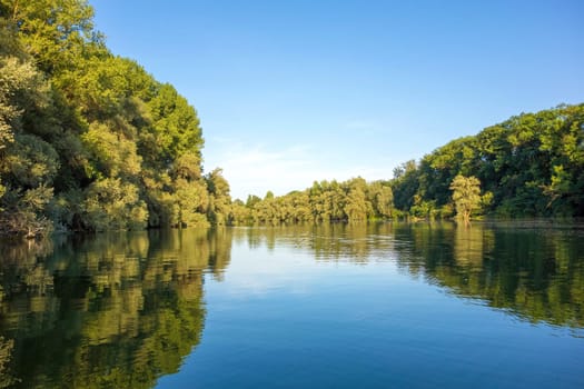 idyllic water landscape, lake with trees around