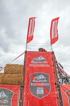 Nurburg, Germany - May 20, 2017: Fishermen's Friend Strongman RUN at race track Nurburgring - straw bale obstacle