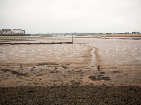 a line in the mud at the beach river  England  UK