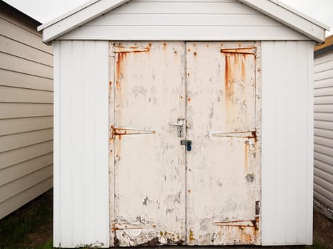 close up of shed door white rusted grunge dirty  England  UK