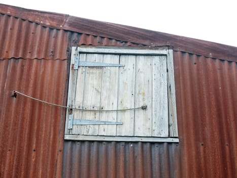close up of special latch door in metal rusted roof  England  UK