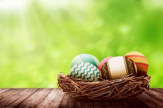 Decorated egg inside the nest. Happy easter concept