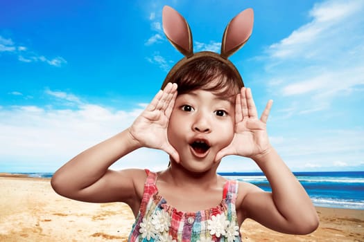 Cute little child girl wearing bunny ears on Easter day