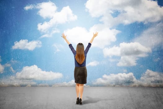 Back view of business woman looking at grunge blue sky. Conceptual Image