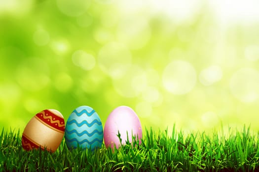 Decorated egg on the grass. Happy easter concept