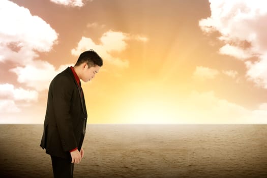 Asian business man looking stress on the desert