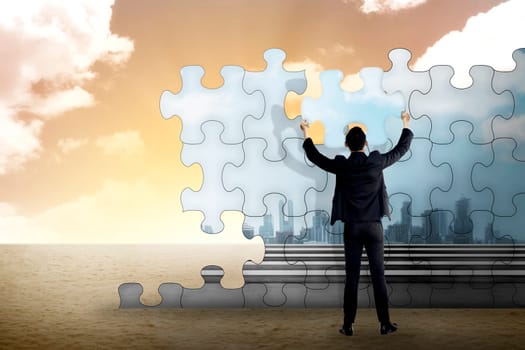 Business person building puzzle of city in the desert. Business building concept