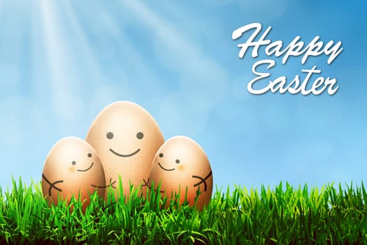 Three easter eggs with smile drawing put on the grass