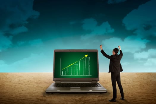 Business person looking giant laptop on the desert. Wireless concept