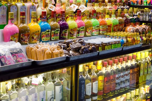 OAXACA, MEXICO - MARCH 5: Colorful bottles of mezcal for sale in marketplace in Oaxaca, Mexico on March 5, 2017