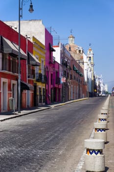 Colorful street with houses and churches in Puebla, Mexico