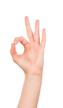 Woman hand in ok sign on a white isolated background
