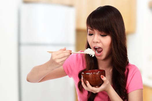 Asian pretty woman eating japanese food. Eat concept