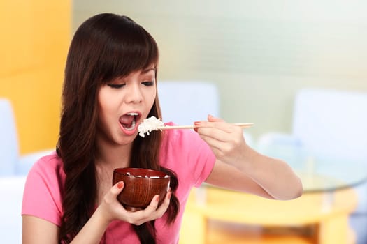 Asian pretty woman eating japanese food. Eat concept