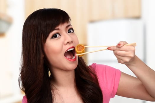 Asian pretty woman eating japanese food. Eat concept