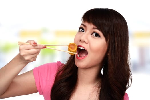 Asian pretty woman eating japanese food. Eat concept