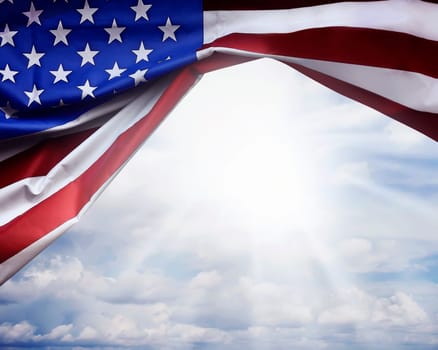 Crumpled American flag. American flag on sky background.
