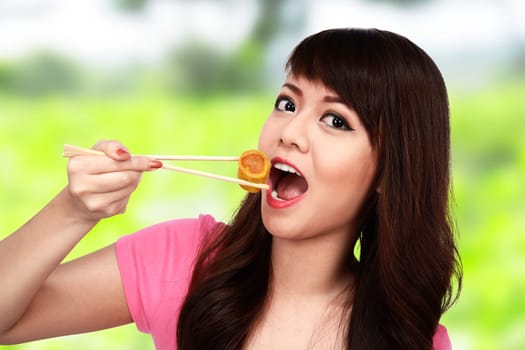 Asian pretty woman eating japanese food. Eat concept
