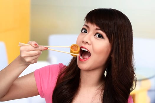 Asian pretty woman eating japanese food. Eat concept
