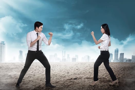 Business man and woman fighting. Working competition concept