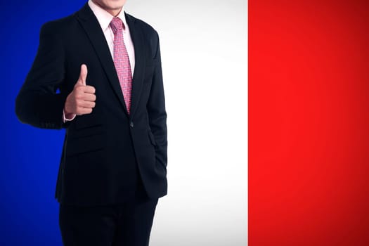 Man show thumb up with france flag behind him. Patriot concept