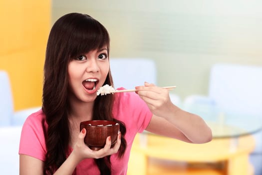 Asian pretty woman eating japanese food. Eat concept