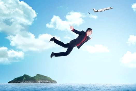 Business man jumping from airplane to the island