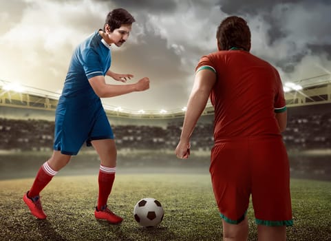 Image of football player dribbling ball intercepted by other