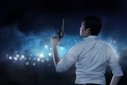Secret agent holding gun ready to fire