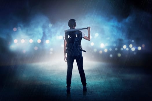 Pretty woman in police vest holding baseball bat as weapon