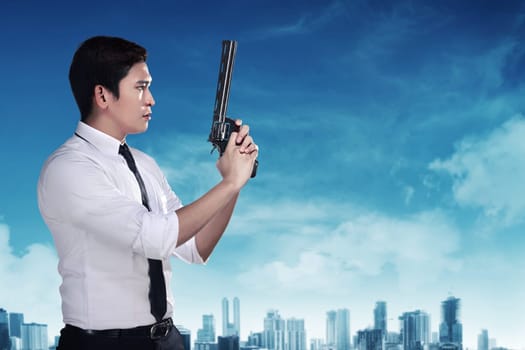 Secret agent holding gun ready to fire