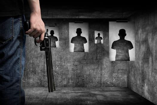 Man hand holding gun