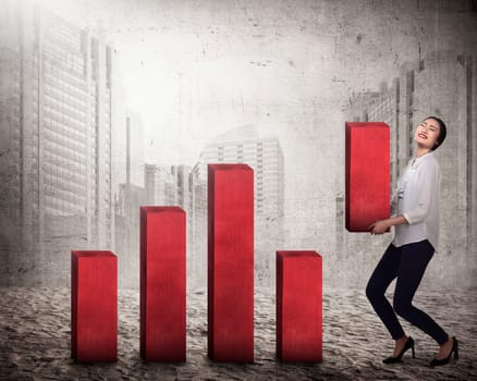 Asian business woman lifting block of chart. Business challenge concept