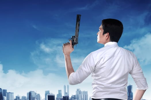 Secret agent holding gun ready to fire
