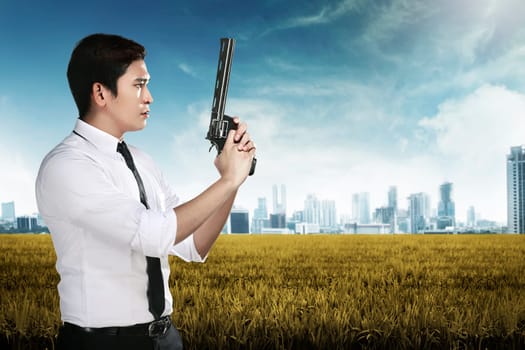 Secret agent holding gun ready to fire