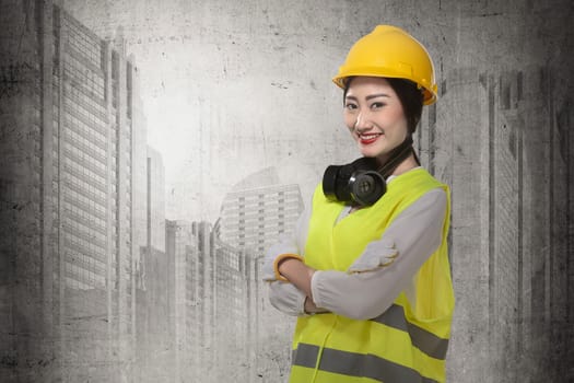 Asian business woman wearing yellow helmet smile over construction sites background