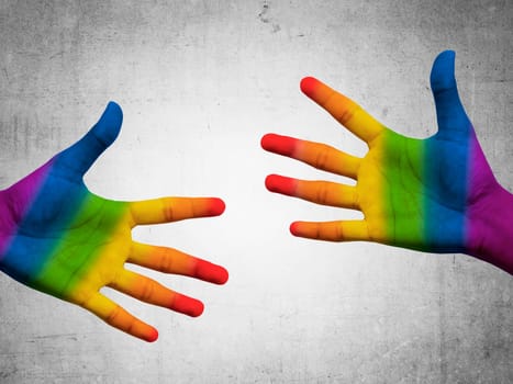 Two hand with gay flag color. Gay pride conceptual