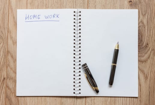 open notebook waiting for home work ready pen
