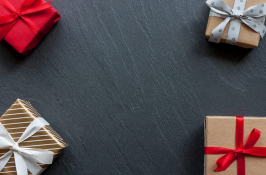 beautiful wraped gift boxes on black background