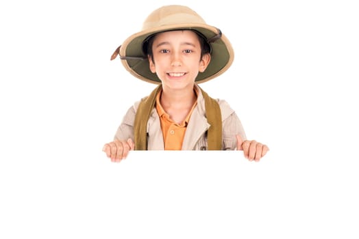 Young boy with Safari clothes behind a white board isolated in white