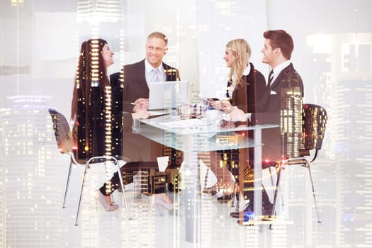 Full length of businesspeople working at desk in office