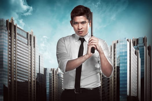 Secret agent holding gun ready to fire