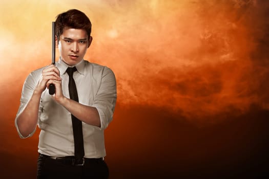 Secret agent holding gun ready to fire