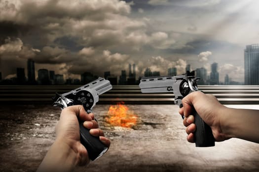 Man hand holding two gun and aiming to the burn city