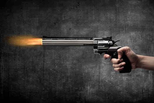 Man hand holding gun and firing it
