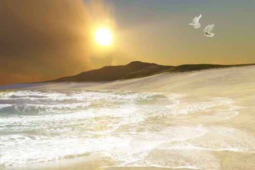 Two white doves fly over waves coming in to an ocean shore.